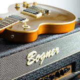 Gibson Les Paul Classic 1993 Goldtop laying on top of Bogner Shiva 20th Aniiversary amplifier