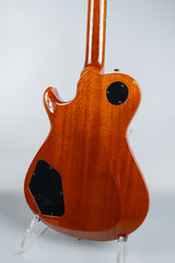 Back view of a wooden electric guitar Knaggs Kenai on a white background