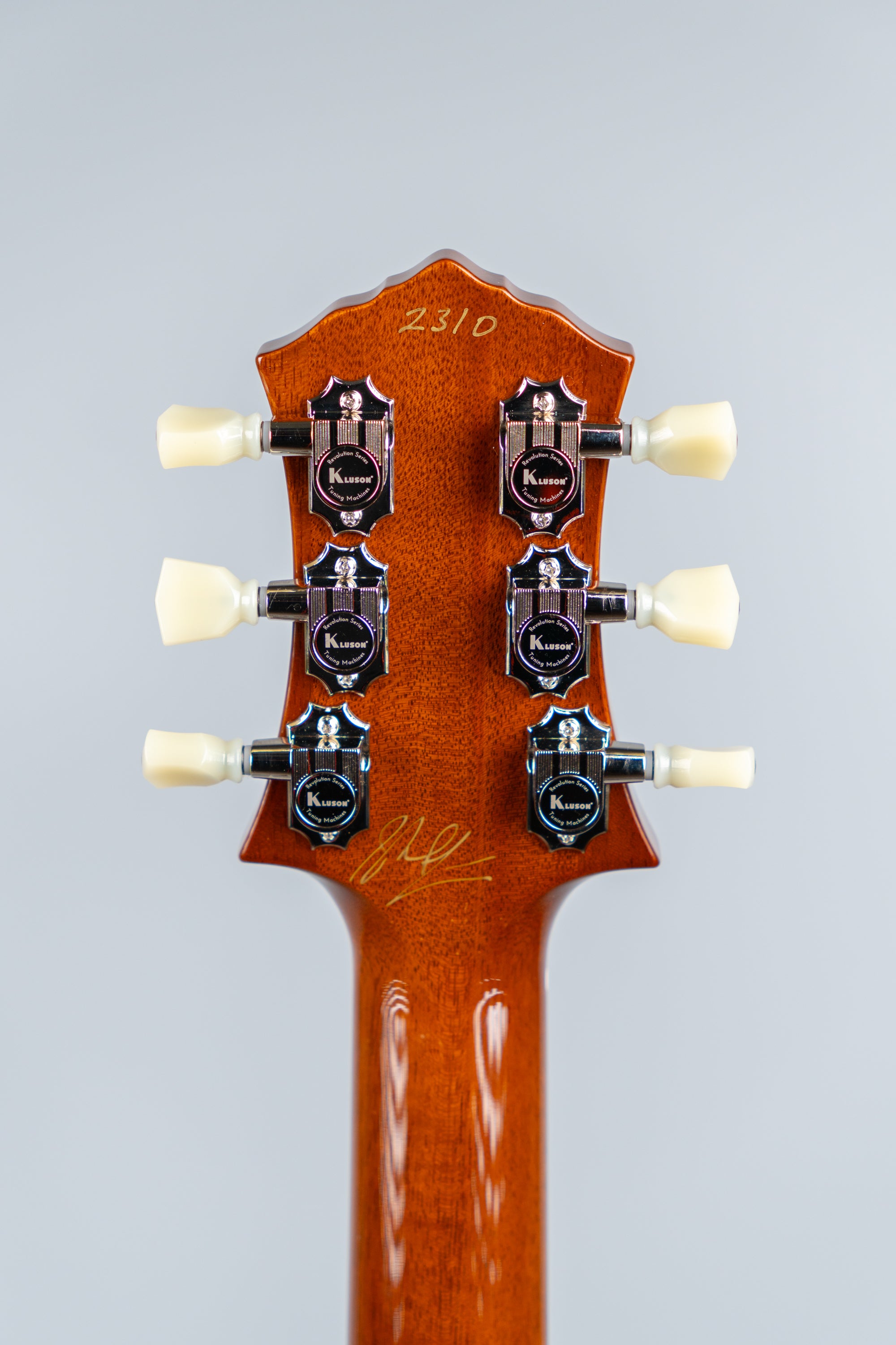 Knaggs Kenai electric guitar back of the headstock with Kluson tuning pegs on a gray background